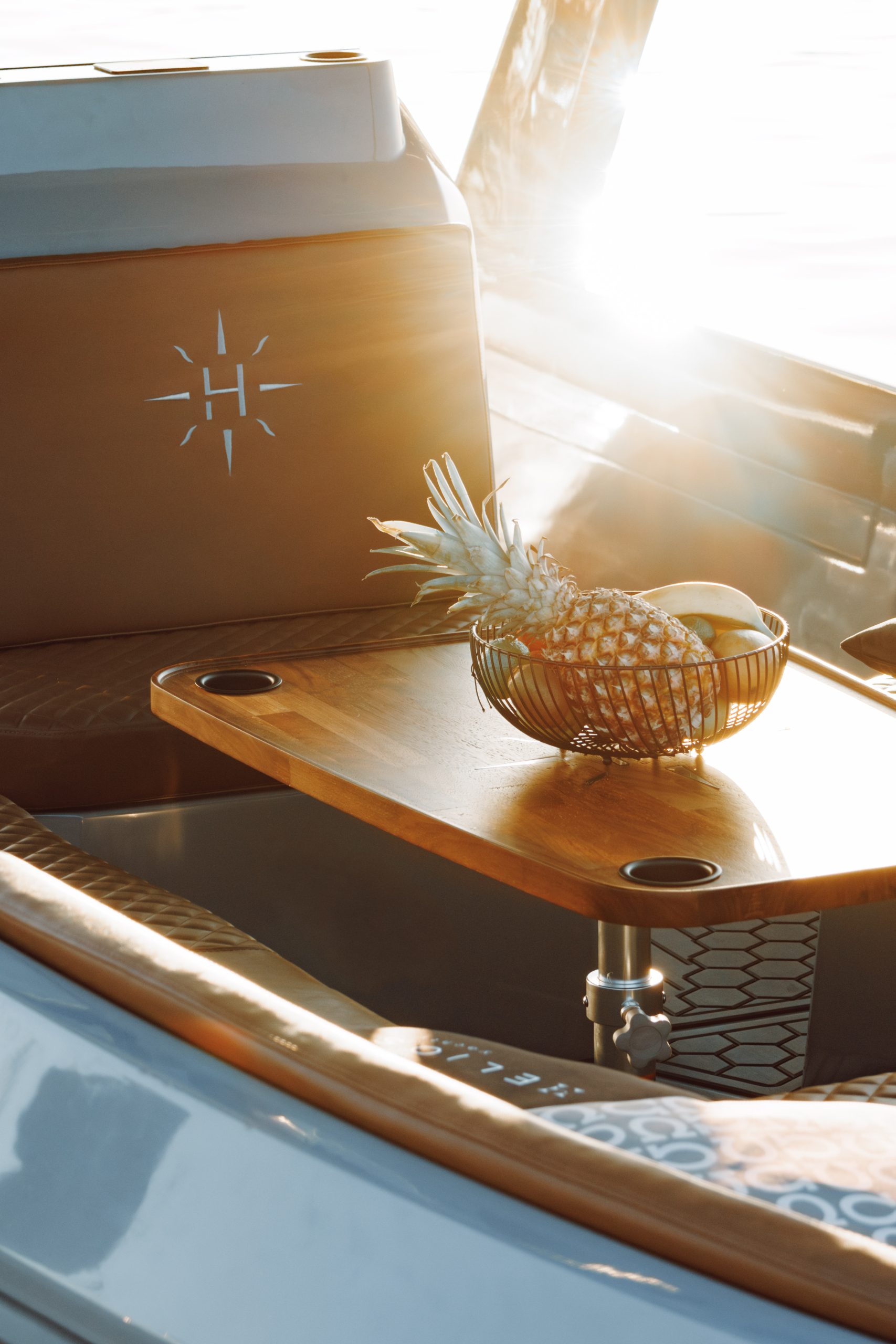 Interior of the Helios Omega 7.2 with a wooden table and seating area