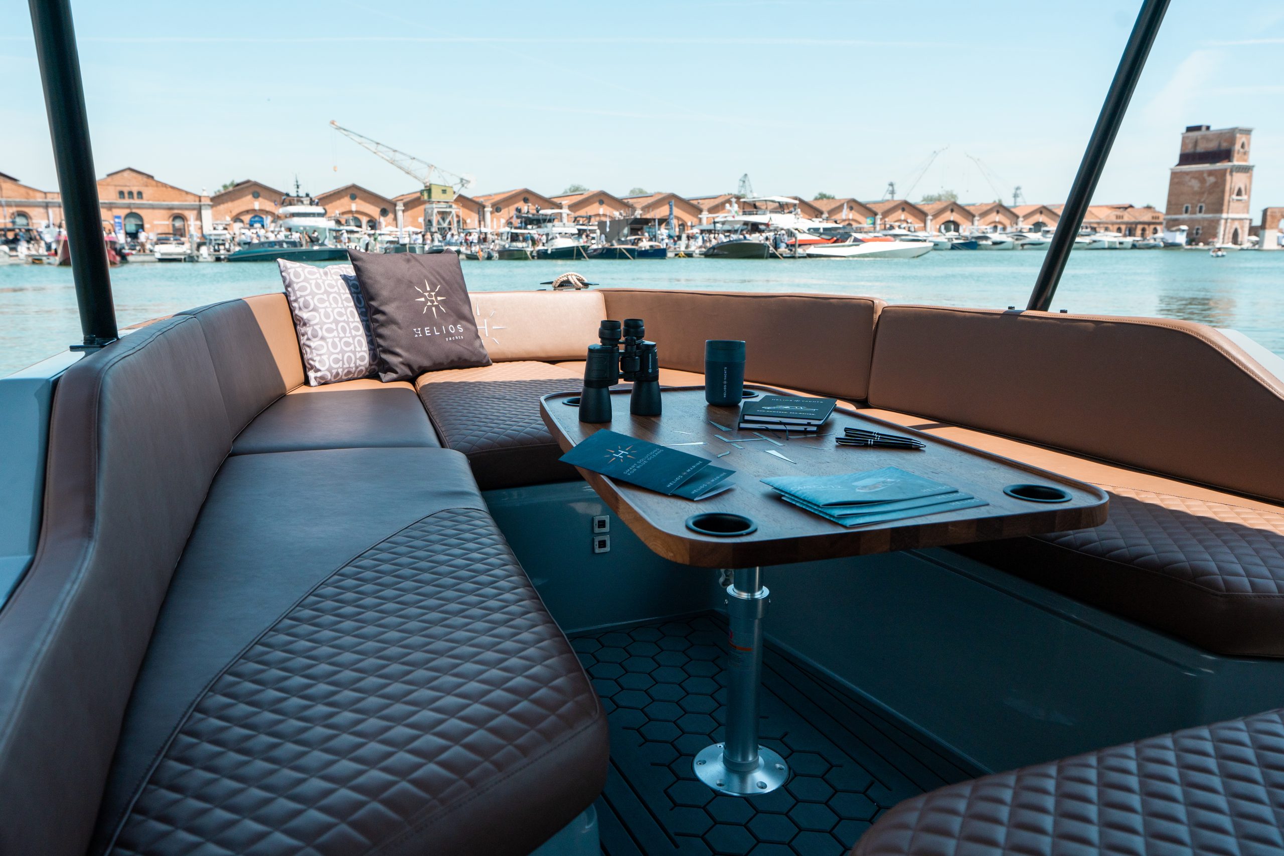 Seating area of the Helios Omega 7.2 with table and brochures